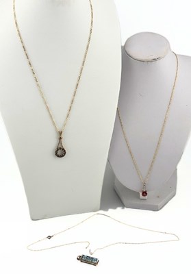Lot 509 - Three gem pendants