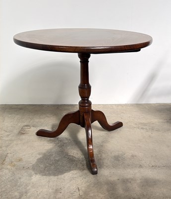 Lot 788 - A 20th century oak tilt top tripod table in...