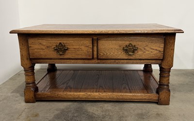Lot 830 - A late 20th century oak media stand / TV or...