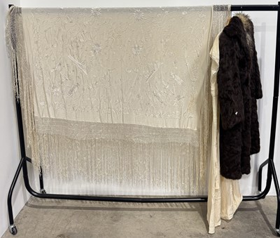 Lot 749 - A large white fringed piano shawl, c.1900,...