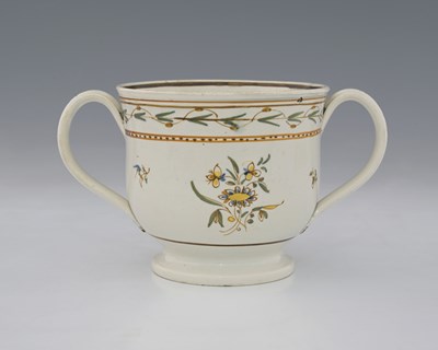 Lot 767 - A Prattware twin handled loving cup, circa...