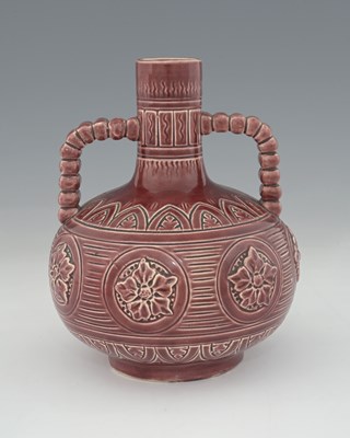 Lot 282 - An Aesthetic Movement twin handled faience...