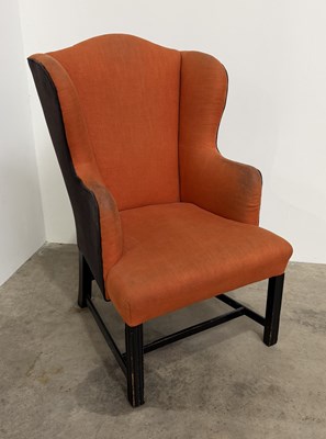 Lot 843 - A 20th century wingback armchair in the...