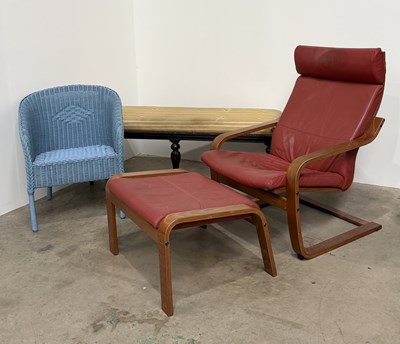 Lot 834 - An Ikea Poang red leather and bentwood chair,...