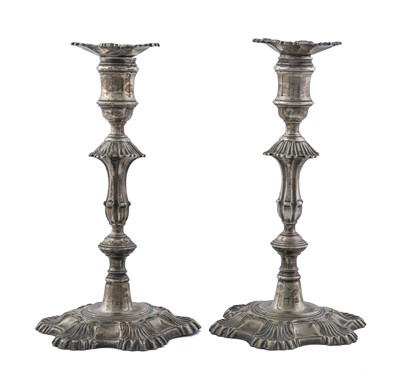 Lot 216 - A pair of George II cast silver candlesticks,...