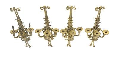 Lot 114 - A set of four cast and gilt bronze three...