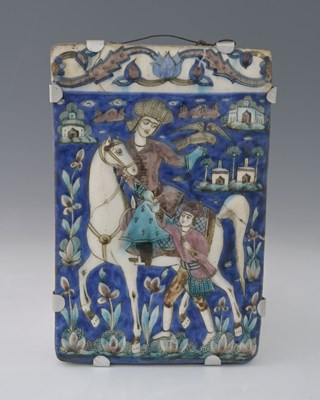 Lot 148 - A Persian relief moulded tile, modelled and...