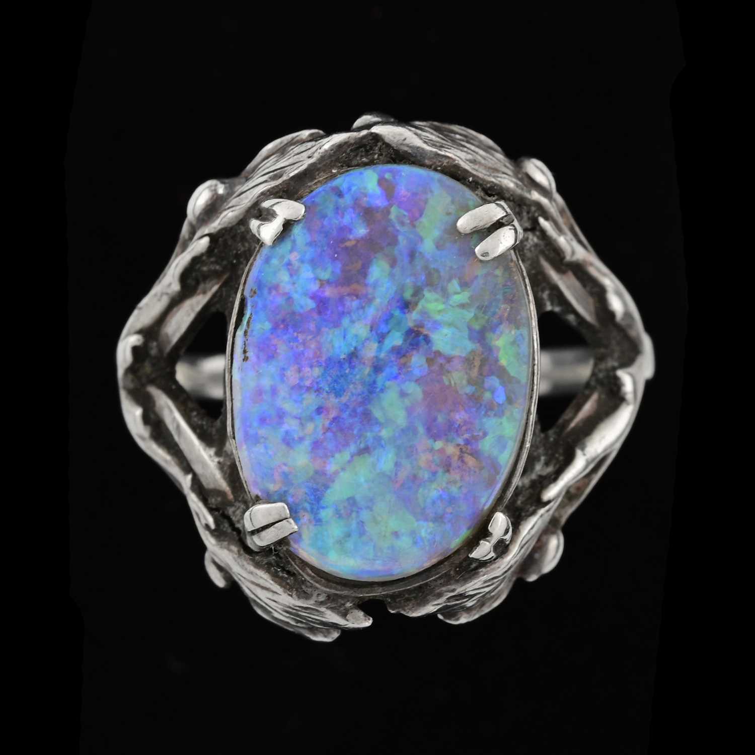 Lot 33 - An Arts and Crafts silver and opal ring, the...