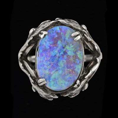 Lot 33 - An Arts and Crafts silver and opal ring, the...