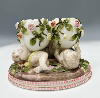 Lot 211 - A Meissen style figural triple egg stand,...