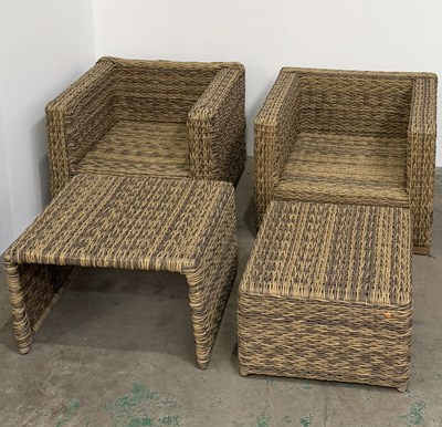 Lot 868 - A pair of natural rattan effect sun lounger...