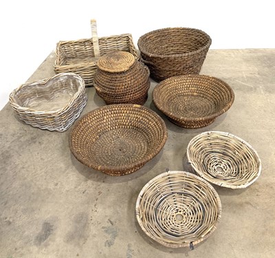 Lot 797 - A collection of African straw baskets and...