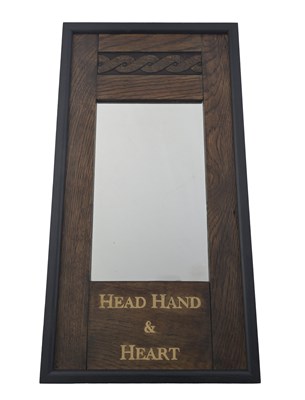Lot 627 - An Arts and Crafts oak mirror, circa 1910,...