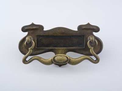 Lot 601 - An Arts and Crafts brass letter box door...