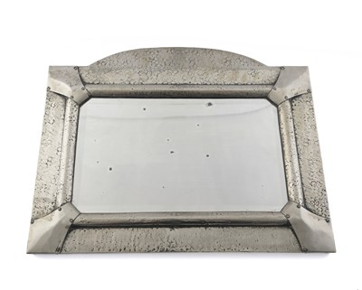 Lot 625 - An Arts and Crafts silvered metal wall mirror,...