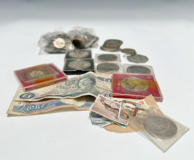 Lot 243 - A small collection of coins, including twelve...