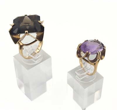 Lot 406 - Two 9ct gold smoky quartz and amethyst single stone rings