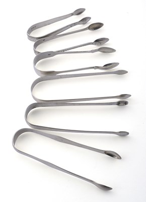 Lot 218 - A group of six hallmarked silver sugar tongs,...