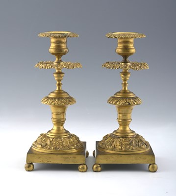 Lot 645 - A pair of Regency gilt ormolu candlesticks,...