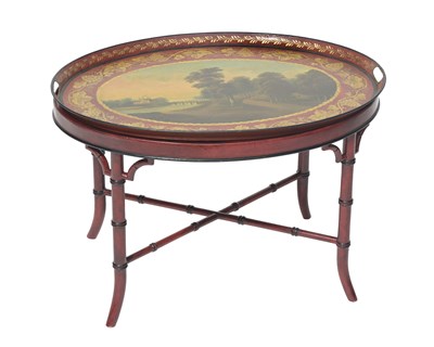 Lot 654 - A Toleware oval twin-handled tray, French,...