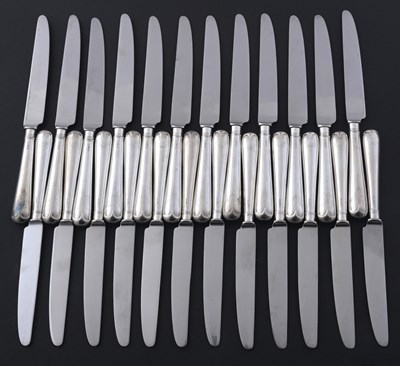 Lot 284 - A suite of Elizabeth II knives, by Strickett &...