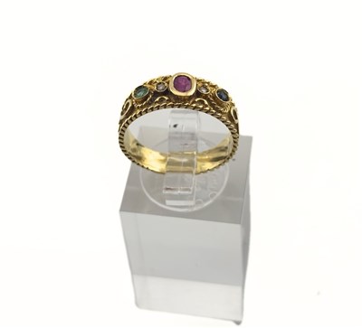 Lot 412 - A ruby, emerald, sapphire and brilliant-cut diamond band ring