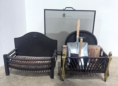 Lot 312 - Two cast iron fire baskets, to include: a bow...