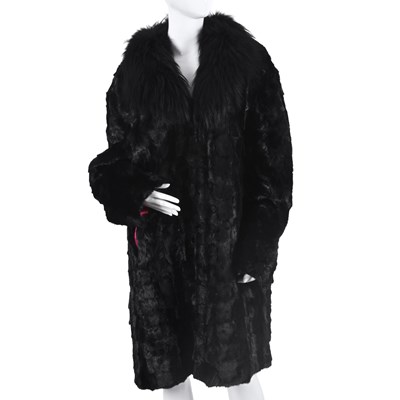 Lot 604 - A pieced black mink coat w/ fox fur collar.