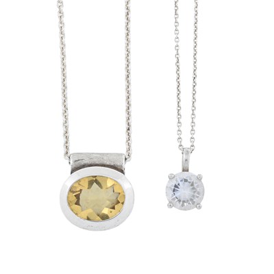 Lot 517 - Two pendants and chains