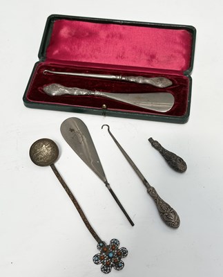 Lot 231 - A cased button hook and shoehorn set, Art...