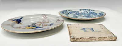 Lot 124 - A Delft polychrome landscape plate, circa 1750,...