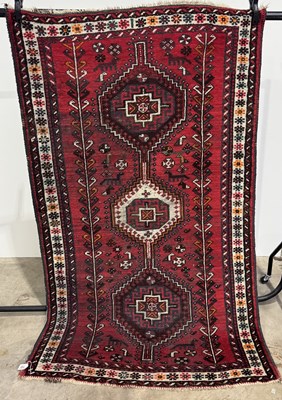 Lot 755 - A hand knotted Persian wool rug, Shiraz type,...