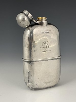Lot 107 - An Edwardian silver hip flask, of rounded...