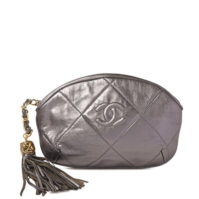 Lot 321 - Chanel, a vintage leather tassel clutch.