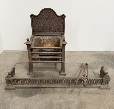 Lot 786 - An Arts and Crafts cast iron fire basket in...