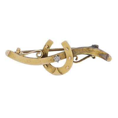 Lot 479 - An early 20th century 15ct gold old-cut diamond horseshoe bar brooch