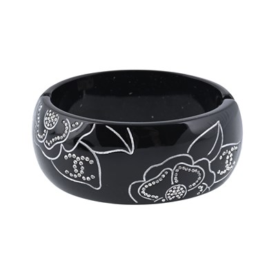 Lot 346 - Chanel, a black resin Camellia cuff bangle.