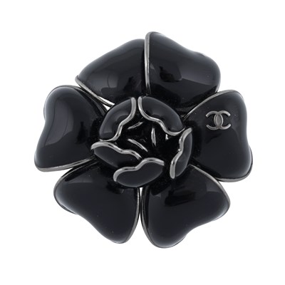 Lot 347 - Chanel, a black enamel Camellia brooch.