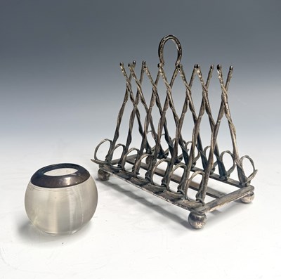 Lot 316 - A novelty silver-plated toast rack of sporting...