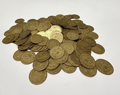 Lot 304 - A collection of gold coloured gaming tokens,...