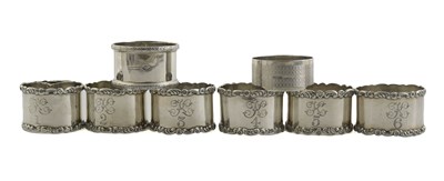 Lot 260 - A group of silver napkin rings, to include a...