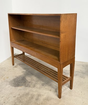 Lot 768 - A mid century Cotswold School oak bookcase on...