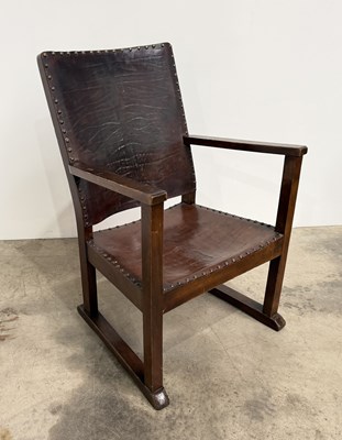 Lot 816 - An A.W. Simpson style leather and oak low...