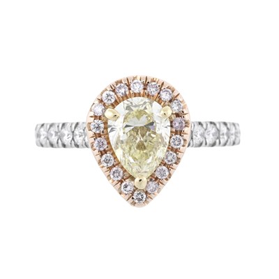Lot 202 - A natural Fancy Light Yellow pear brilliant-cut diamond and brilliant-cut diamond cluster ring