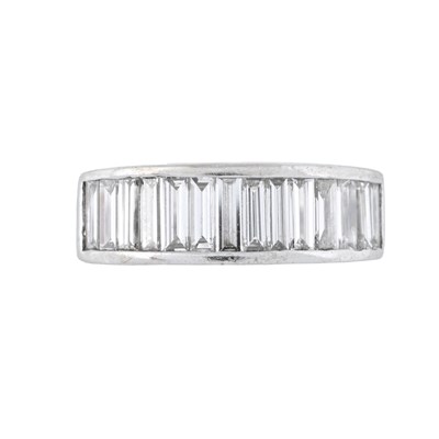 Lot 152 - A baguette-cut diamond half eternity ring