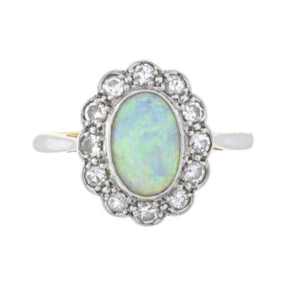Lot 81 - An opal and brilliant-cut diamond cluster ring