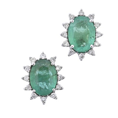 Lot 151 - A pair of 18ct gold emerald and brilliant-cut diamond cluster stud earrings