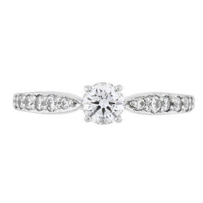 Lot 116 - Tiffany & Co., a brilliant-cut diamond single stone ring, with diamond line shoulders