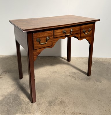 Lot 758 - A late 18th century mahogany low boy: three...
