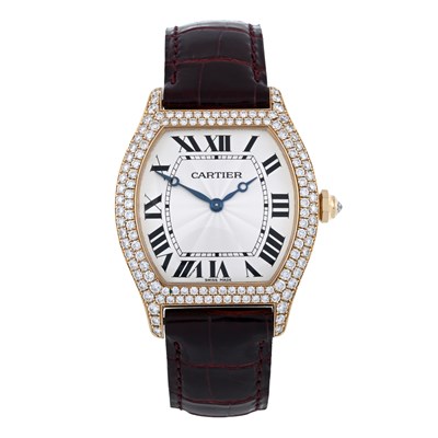Lot 207 - Cartier, an 18ct gold diamond set Tortue wrist watch